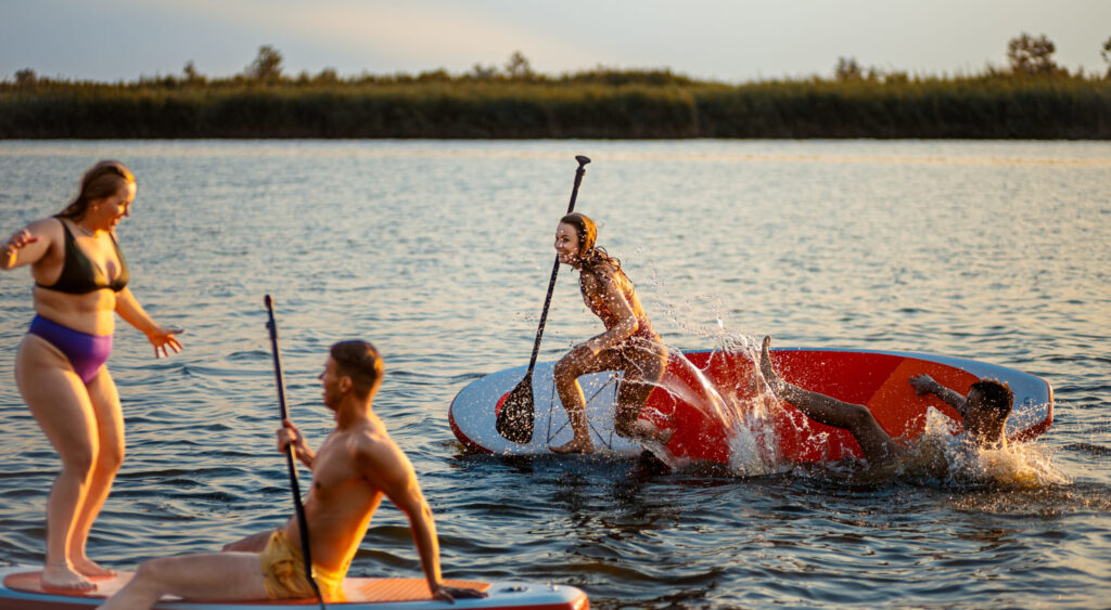 Family group paddleboarding