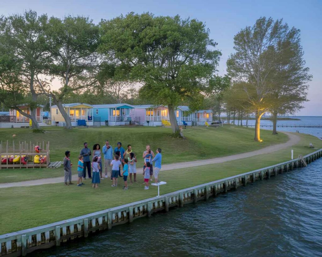 Camp Somatic guests gathered outdoors on a family trip